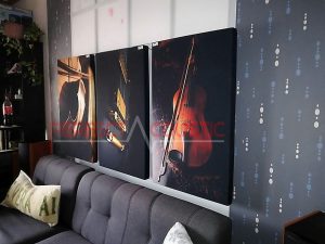 a printed acoustic panel placed on the wall in the cinema room